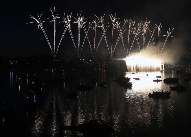 FILE — Fireworks light up the sky over the Manette Bridge during the Bremerton Bridge Blast in June 2019.