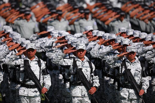 Elements of the National Guard salute during the ceremony of deployment of the new Mexican security force National Guard at Campo Marte in Mexico City, Mexico. The new force will be comprised of federal and military police as well as members of the Mexican Army. 