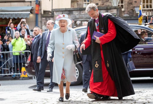 Britain's Queen Elizabeth II talks with Reverend Neil Gardner as she attends the Sunday Church service at Canongate Kirk in Edinburgh, Scotland.