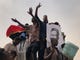 Sudanese protesters shout slogans during a demonstration against the ruling military council, in Khartoum, Sudan. Tens of thousands of protesters took to the streets in Sudan's capital and elsewhere in the country calling for civilian rule nearly three months after the army forced out long-ruling autocrat Omar al-Bashir.