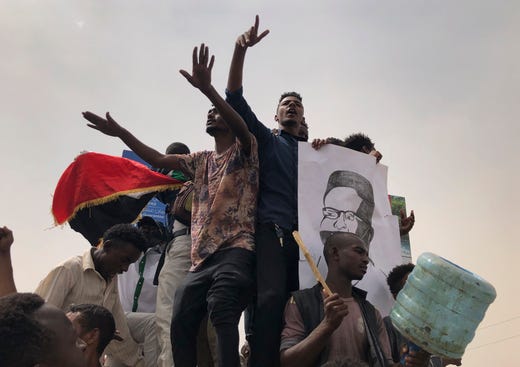 Sudanese protesters shout slogans during a demonstration against the ruling military council, in Khartoum, Sudan. Tens of thousands of protesters took to the streets in Sudan's capital and elsewhere in the country calling for civilian rule nearly three months after the army forced out long-ruling autocrat Omar al-Bashir.