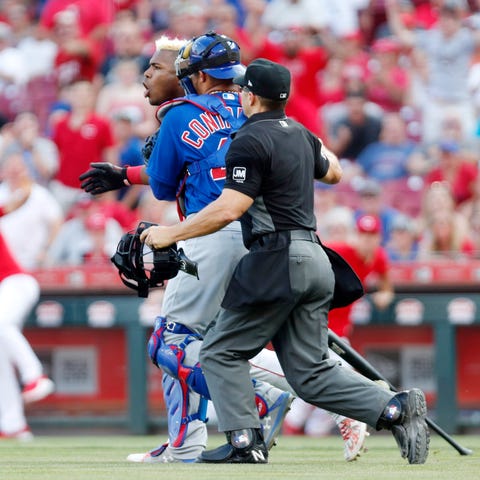 Cincinnati Reds right fielder Yasiel Puig is...