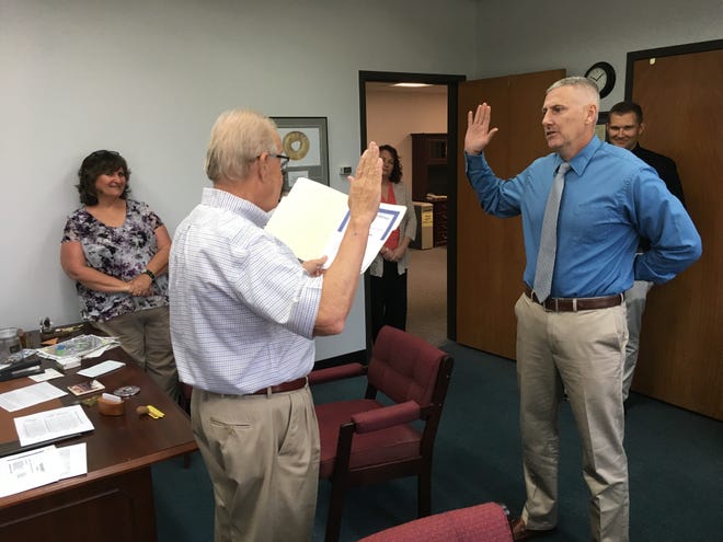 Sean McKinney gets sworn in on Monday morning in Mayor Steve Austin’s office witnessed by Human Resources Director Connie Galloway and Henderson Police Chief Heath Cox.