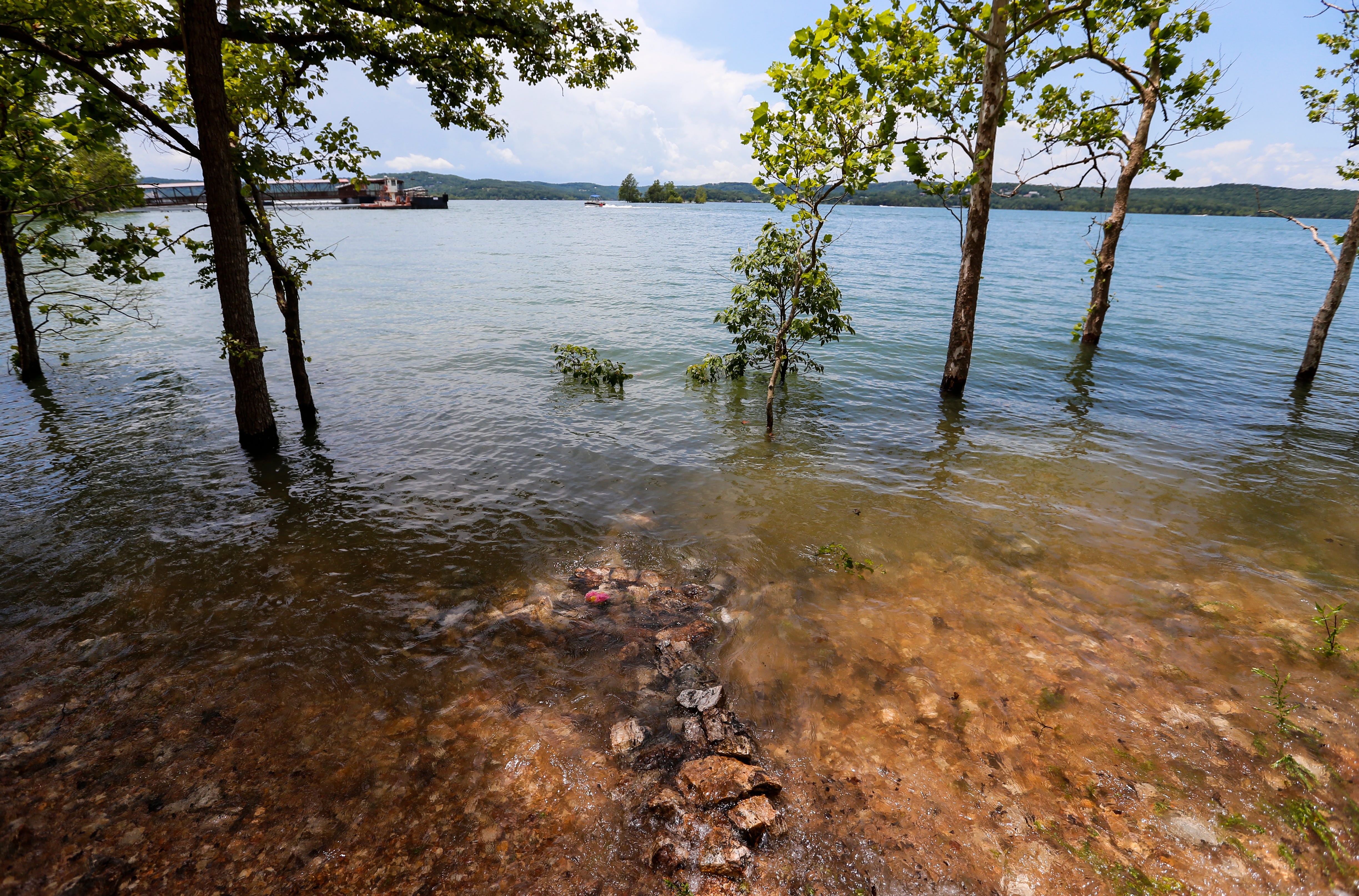 A cross made from rock is submerged in Table Rock Lake's waters near where Stretch Duck 7 sank, killing 17 people on July 19 of last year.