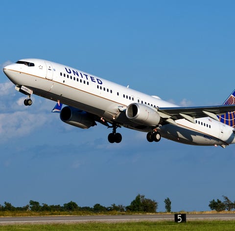 A United Airlines flight takes off from an airport