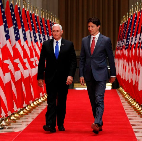 US Vice President Mike Pence (L) and Canadian...