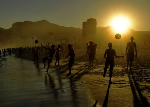 Beachgoers play with balls at Ipanema Beach in Rio de Janeiro, Brazil, on June 29, 2019. Tourists from all over Latin America have arrived in Rio for the Copa America soccer tournament.