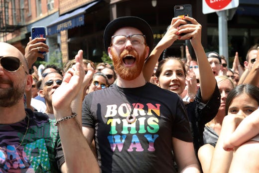 Kyle Motsinger, center, participates in the second annual Stonewall Day honoring the 50th anniversary of the Stonewall riots in Greenwich Village, June 28, 2019, in New York.