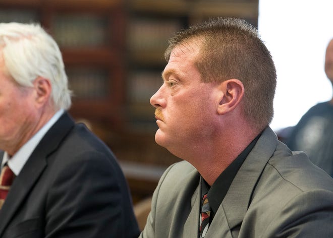 Pike County Sheriff Charles Reader listens to Judge Chris Martin during his arraignment in the Pike County Courthouse on July 2, 2019, in Waverly, Ohio. Reader plead not guilty to 16 criminal charges ranging from theft to tampering with evidence.