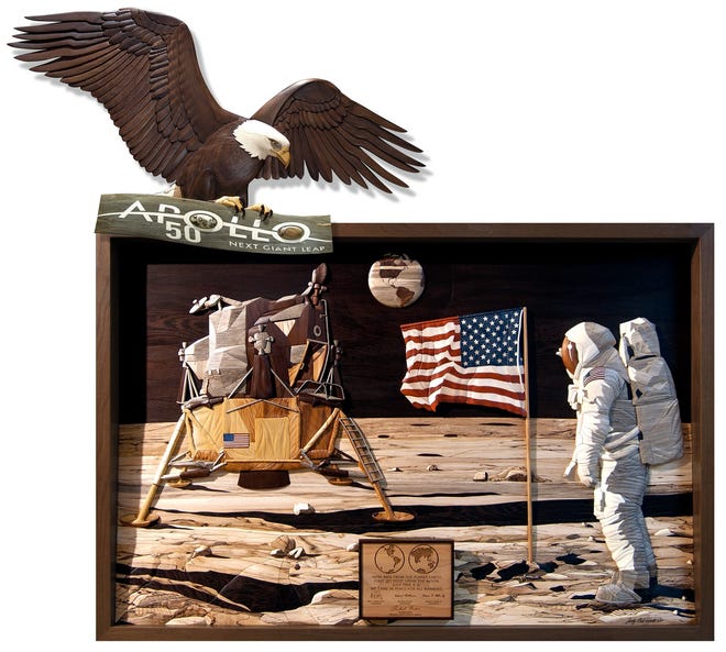 Judy Gale Roberts' commemorative Intarsia woodwork for the 50th anniversary of Apollo 11 spotlights the historic moment of U.S. history of the Moon landing.