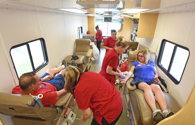 David Latchuk and Annette Powers are taken care of Wednesday afternoon by blood collectors from the American Red Cross. Over 100 donors signed up to donate blood and received a free Dairy Queen Blizzard on Ashland Road for their generosity.