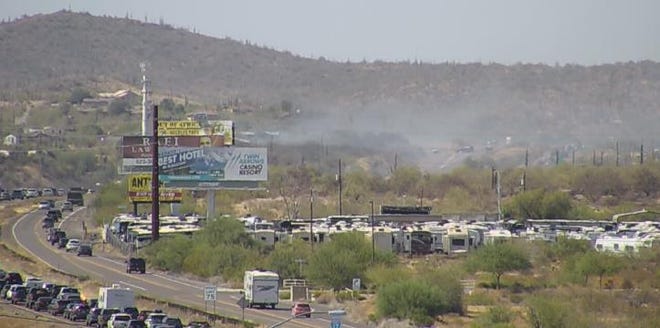 A brush fire caused traffic jams and closed a stretch of the Interstate 17 north of Phoenix on July 3, 2019.