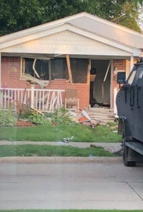 A 60-year-old man has been barricaded inside his St. Clair Shores home since Thursday night when he allegedly shot two neighbors for shooting off fireworks.