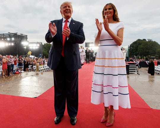 President Donald Trump and first lady Melania Trump are pictured leaving the Independence Day celebration in front of the Lincoln Memorial.