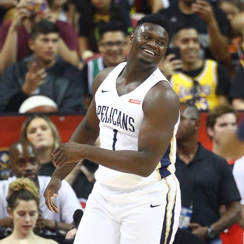 Zion Williamson reacts after a dunk in the first...