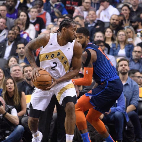Kawhi Leonard and Paul George during a March game.