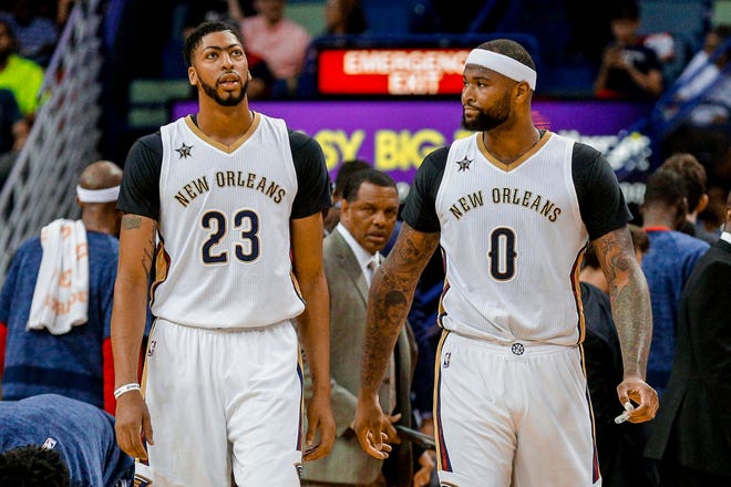 New Orleans Pelicans forward Anthony Davis and forward DeMarcus Cousins during the second quarter of a 2017-18 game against the Sacramento Kings at the Smoothie King Center.