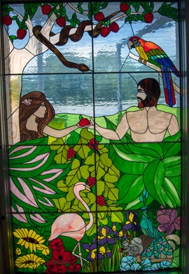 A glass panel depicts God's creatures in the downstairs foyer of Salem United Church of Christ in Jacobus.
