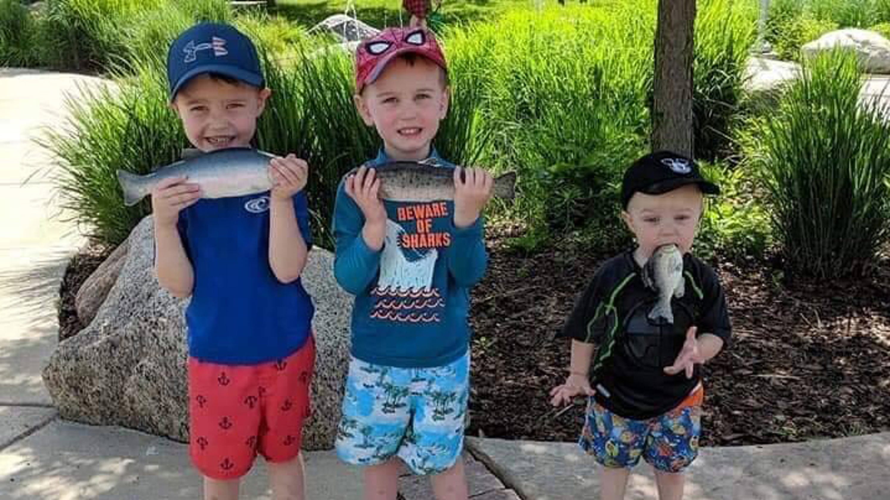 Image: https://www.gannett-cdn.com/presto/2019/07/08/PAPN/fb49651e-c9c2-484f-829a-1aedc4d7fd15-fish.jpg?crop=719,404,x0,y107&width=3200&height=1680&fit=bounds Image result for boy with fish in mouth