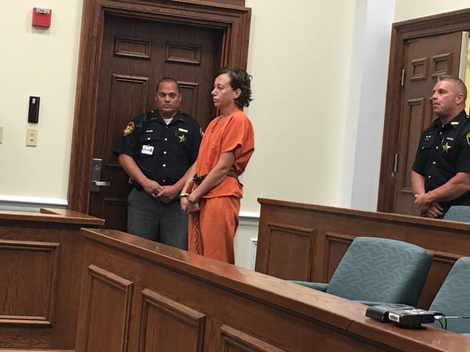 A shackled Angelina Vladimirovna Hamrick in her first court appearance after being charged with killing her husband, Jason Hamrick, in 2019.