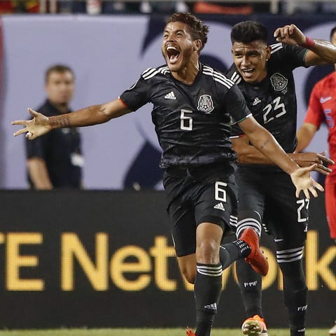 Jonathan dos Santos celebrates after scoring...