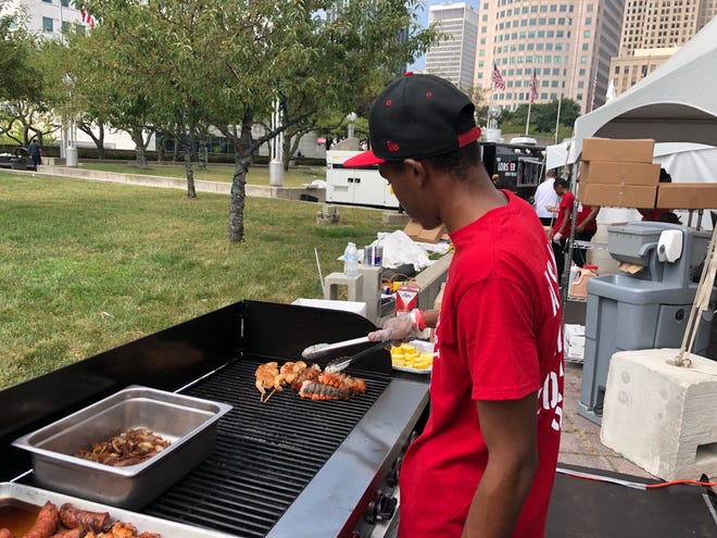 Demarco Patrick grills shrimp skewers and lobster tails at the 2018 Great American Lobster Fest at Hart Plaza. It returns for a second year Sept. 13-15.