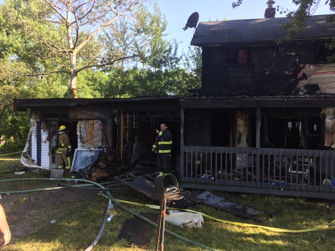 Firefighters were back on the scene of a house fire on Tuesday morning. The fire destroyed the house at 1004 Hanna Road in Madison Township.