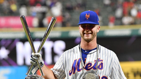 Pete Alonso celebrates after winning the Home Run...