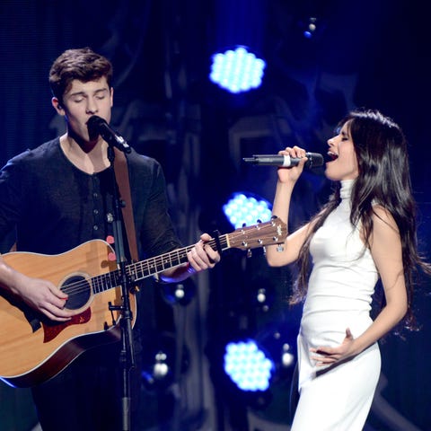 Shawn Mendes and Camila Cabello perform onstage...