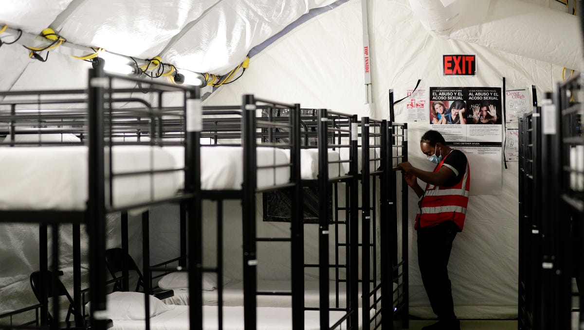 A staff member works in the infirmary, a series of tents, at the U.S. government's newest holding center for migrant children in Carrizo Springs, Texas.