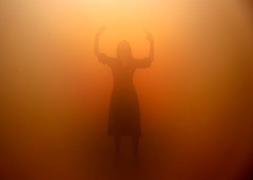 A visitor tries to orientate through a room full of fog called 'Your blind passenger' as part of the exhibition Olafur Eliasson: 'In real life' at the Tate Modern Gallery in London, July 9, 2019. The Tate Modern has brought together around 40 works of Eliasson spanning the last three decades, and are on display from July 11, 2019 until January 5, 2020.