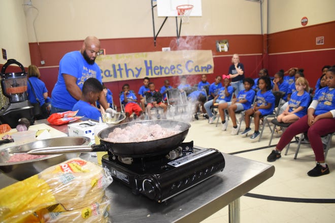 John Belvin Jr., executive chef at the Diamond Grill was the guest speaker at the Healthy Heroes Camp sponsored and coordinated by the Pineville Rotary Club and the Pineville Youth Center. He taught the campers how to make turkey tacos, homemade salsa and homemade guacamole. Dorian Hinkston, 6, was Belvin's helper. Dorian wants to be a chef when he grows up.