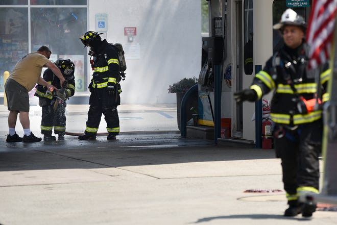 Firefighters on the scene of car fire at the Valero gas station in Hasbrouck Heights on Thursday July 11, 2019.