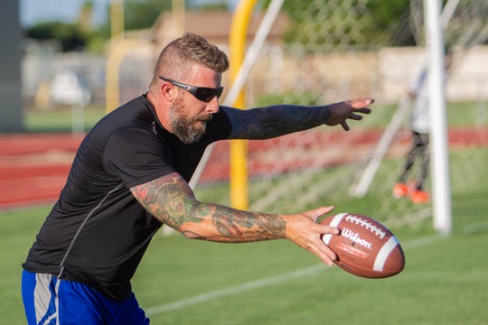 Matthew Edison practices on the Mesa High football field on July 9, 2019.