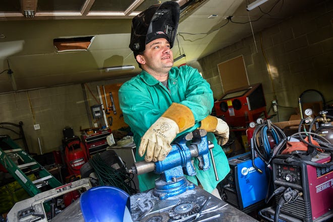 "Mac" Dhein talks about his plans for a community makerspace in his current garage workspace Thursday, July 11, 2019, in St. Cloud.
