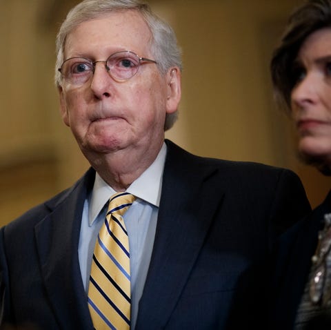 Senate Majority Leader Mitch McConnell  listens du