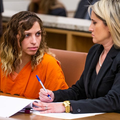 Brittany Zamora looks at her attorney, Belen...