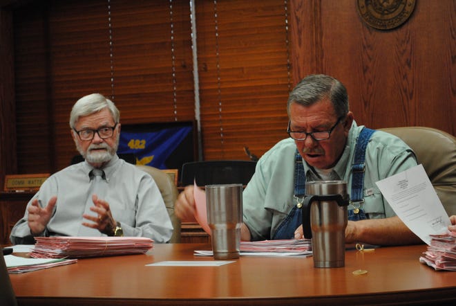 Wichita County Judge Woody Gossom, left, is seen in this July 12, 2019 file photo with Commissioner Lee Harvey during a county commissioners work session.