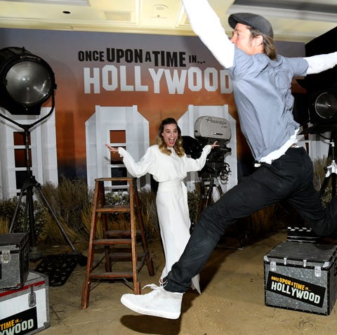 Brad Pitt photobombs Margot Robbie during the...