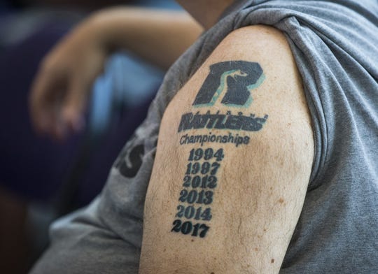 Michael McCarville displays his championship tattoos on his arm during a press conference at Talking Stick Resort Arena in Phoenix, Ariz. July 12, 2017.