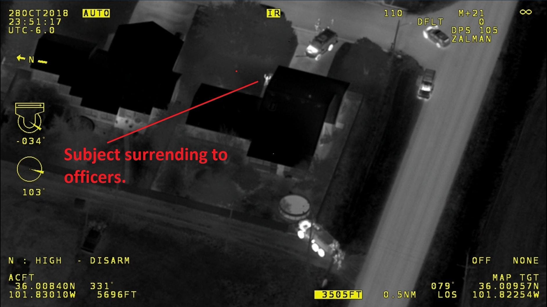 A drone photo shows how police arrested Tim Dean at his house in Sunray, Texas on Oct. 28, 2018. In this photo, Dean can be seen standing outside his house with his hands in the air, surrendering to officers.