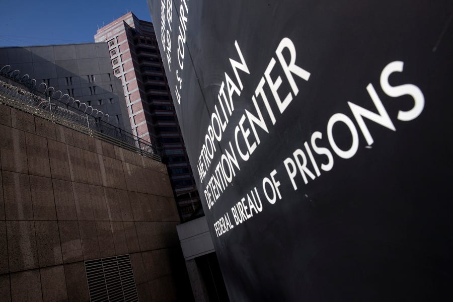 A sign reads 'Metropolitan Detention Center Federal Bureau of Prisons' in front of the facility entrance in downtown Los Angeles, California, USA, 14 July 2019.