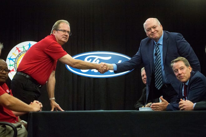 From left, Rory Gamble, UAW Vice President and National Ford Director looks on as United Auto Workers (UAW) union President Gary Jones shakes hands with Ford President and CEO Jim Hackett beside Bill Ford, executive chairman of Ford Motor Co. during the Ford UAW contract ceremonial handshake at Ford World Headquarters in Dearborn, Monday,  July 14th, 2019.