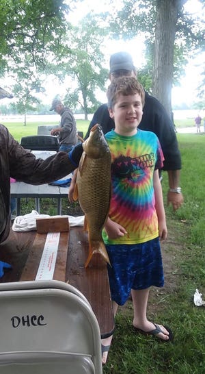 Colton Clark and a catch of the day at the Oak Harbor Conservation Club.