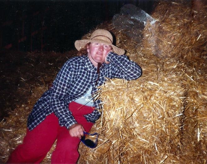 Susan takes a much needed break from baling hay in the hot summer sun.