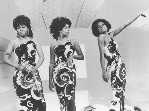 Diana Ross, right, does a solo while Cindy Birdsong, left, and Mary Wilson listen in Taking Care of Business, a one-hour TV musical special featuring the Supremes in 1970. --- DATE TAKEN: 1970 No Byline NBC HO - handout ORG XMIT: PX17079