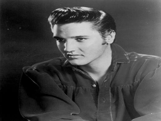 Elvis Presley, the King of rock and roll, is seen at his musical peak in 1957. Fans of the King of Rock 'n' Roll soon will be able to bask in a Beale Street Memphis, Tenn. club that pays him homage. (AP Photo/File) ORG XMIT: NY14