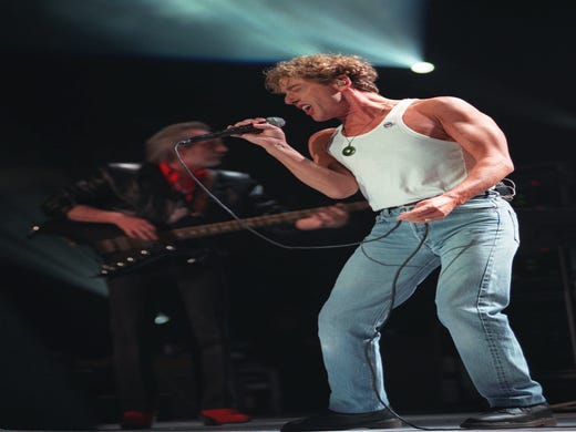Roger Daltrey of The Who belts out a tune at Madison Square Garden in New York as they perform Quadrophenia Tuesday, July 16, 1996. (AP Photo/Wally Santana) ORG XMIT: NYR127
