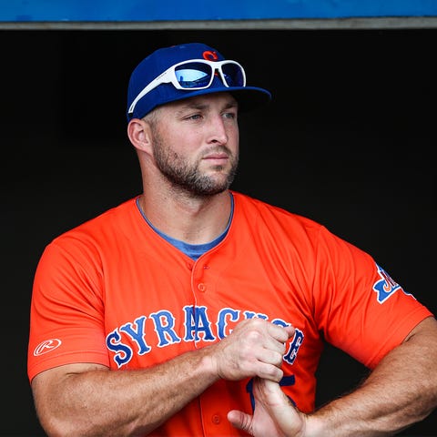 Syracuse Mets outfielder Tim Tebow, a former NFL...