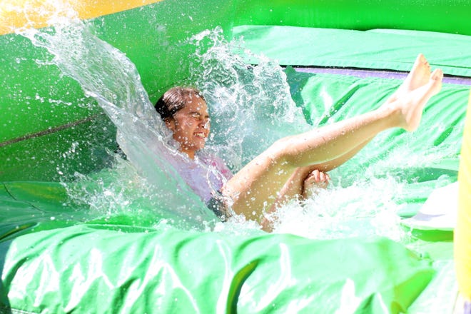 The giant water slide cooled off children during the City of Deming Summer Youth Recreational Program.